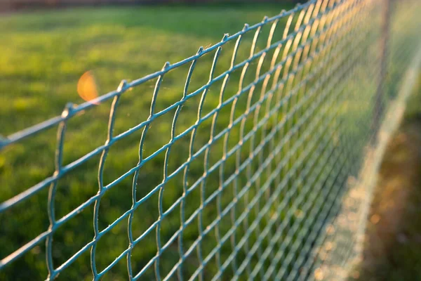 Use of rolled plastic rolls for lawn fencing — Stock Photo, Image