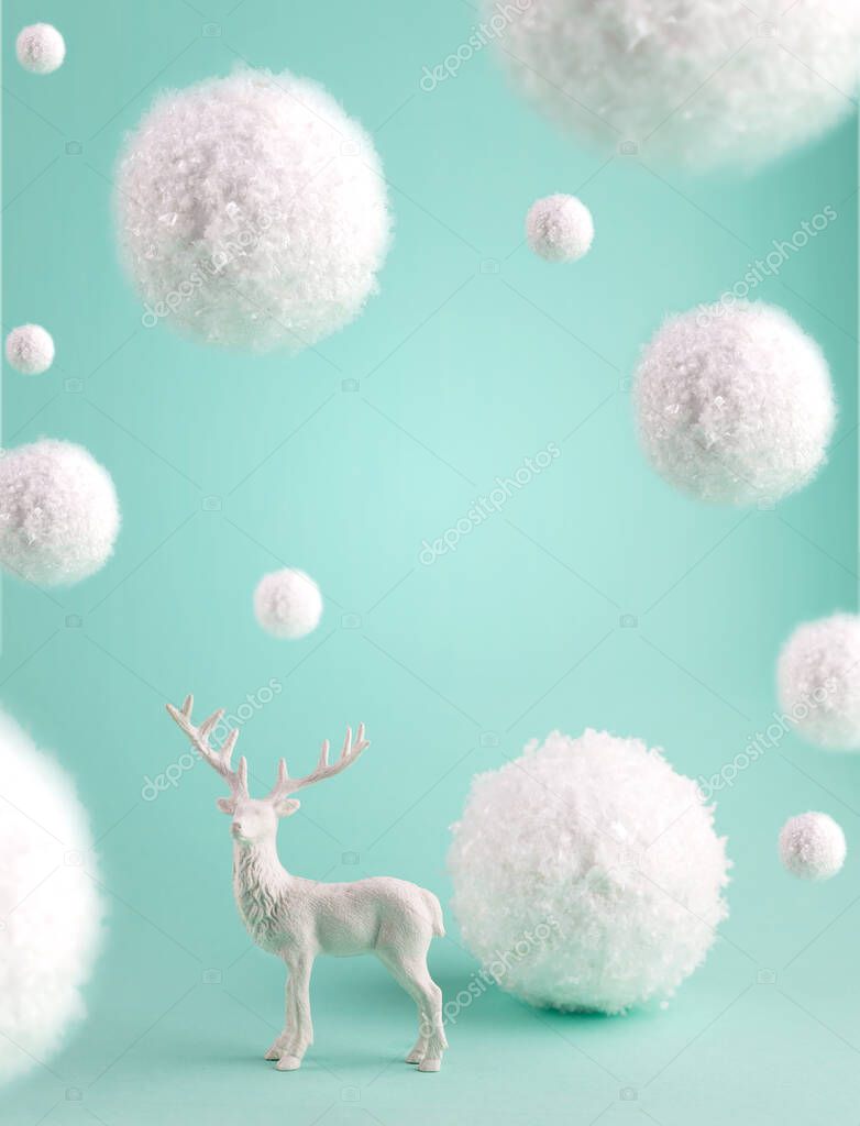 Minimalist Concept Greeting Card with Big Flying Snowballs and white Deer on a turquoise pastel background.