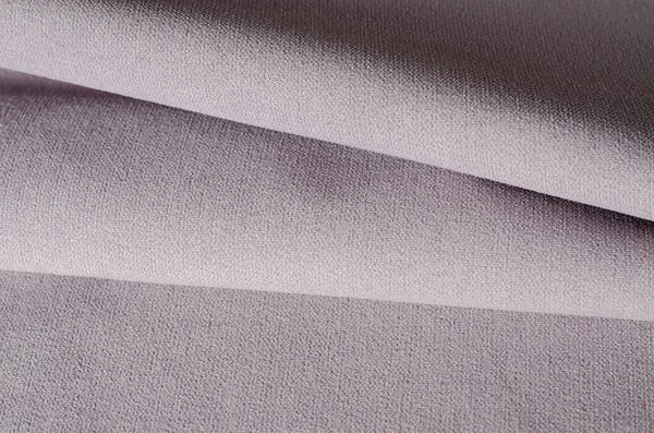 Açık bej ve gri renkli kadife kumaş örnekleri. Kumaş dokusu arkaplanı