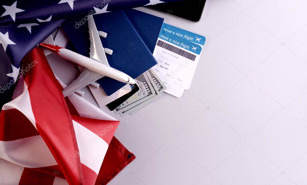 Banner template for preparation treveling by plane Concept objects, documents, united states dollars, passports, boarding pass tickets, glasses, smartphone, and space for text.