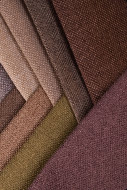 Light Set Yelken Şampanyası kahverengi ve gri renkli topçu tekstil örnekleri. Kumaş doku arkaplanının tonlu fotoğrafı
