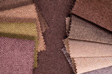 Light Set Yelken Şampanyası kahverengi ve gri renkli topçu tekstil örnekleri. Kumaş doku arkaplanının tonlu fotoğrafı