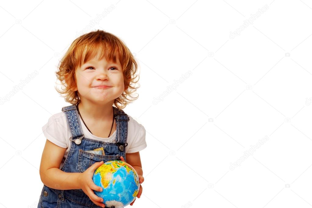 Caucasian Cute little girl in the age of two years holding a globe isolated on  white background, early education concept 