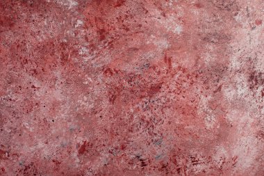 Soyut Beton kırmızı pembe arka plan, sürtünme ve sıçrama var. Yumuşak odaklı, grunge tarzında desenli duvar dokusu. Mesaj için yer var. ağ için kullan