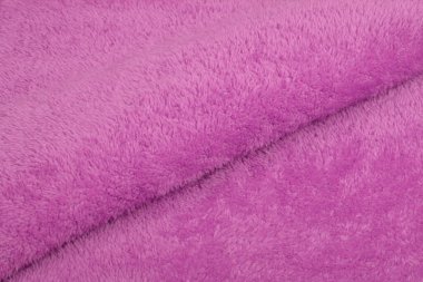 Pembe Karakul Yapay Yapay Yapay Doku, kürk, arka plan, yakın plan. Yumuşak malzeme arka plan, çocuk oyuncakları sahte kürk.