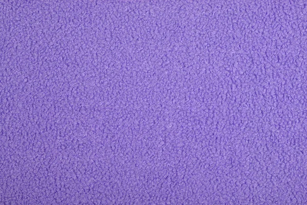 purple Abstract Artificial texture fur fabric, background, closeup. Fluffy material backdrop, kids toys faux fur.