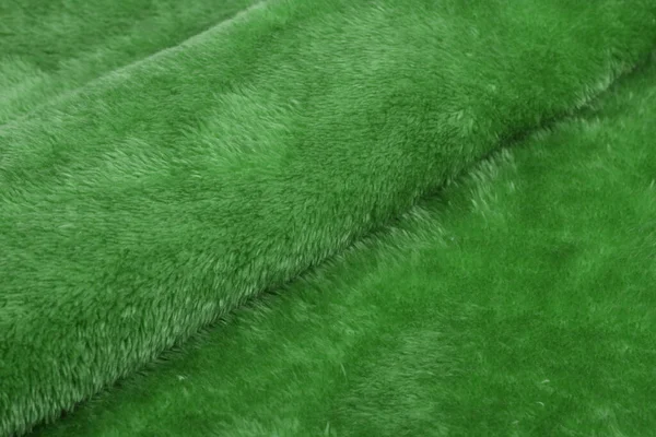 緑カラクル概要人工的な質感の毛皮の生地 ふわふわ素材の背景 子供のおもちゃ フェイクファー — ストック写真