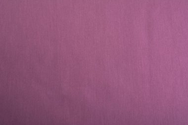 Mor Pamuk doğal kumaş ön görünümü, tasarım çalışmaları için arka plan olarak kullanılabilir. Ön manzara. Elbise ve gömlek dikmek için. Metin için boşluk.