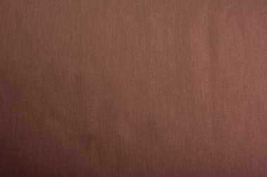 Kahverengi Cotton doğal kumaş ön görünümü, tasarım çalışmaları için arka plan olarak kullanılabilir. Ön manzara. Elbise ve gömlek dikmek için. Metin için boşluk.