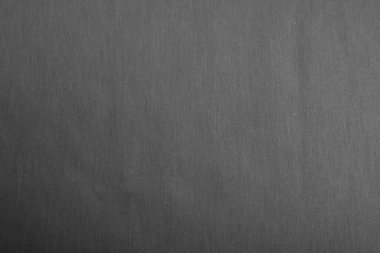 Gri Cotton doğal kumaş ön görünümü, tasarım çalışmaları için arka plan olarak kullanılabilir. Ön manzara. Elbise ve gömlek dikmek için. Metin için boşluk.