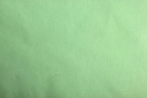 緑の綿の自然なファブリックフロントビューは デザイン作品の背景として使用することができます 正面図 縫製服やシャツのために テキストのスペース — ストック写真