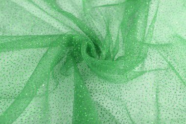 Hafif yeşil buruşuk, güzel örtünmüş, ışıltılı tül kumaş. Gelinlik, duvak, elbise, etek deseni. Moda endüstrisini kopyalamak için kullan. Yumuşak odaklanmayı kapat