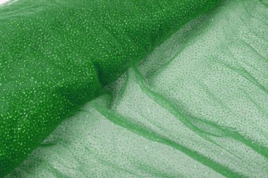 Hafif yeşil buruşuk, güzel örtünmüş, ışıltılı tül kumaş. Gelinlik, duvak, elbise, etek deseni. Moda endüstrisini kopyalamak için kullan. Yumuşak odaklanmayı kapat