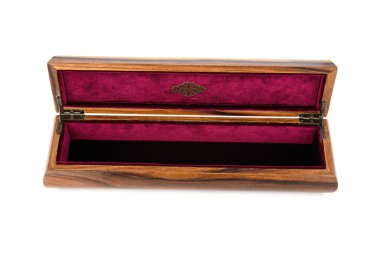 Open wooden jewelry box with velvet lining