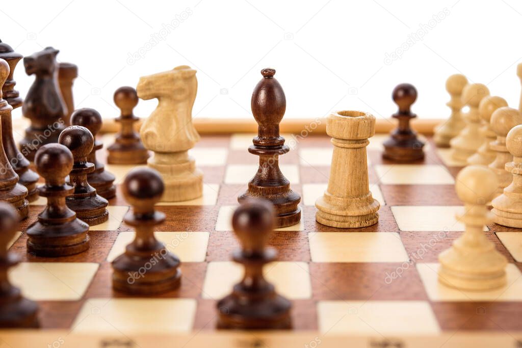Beige Brown Wooden chess different pieces igures standing on chessboard. Close up game concept competition, Classic Tournament.