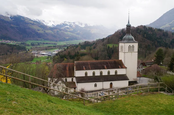 Beautiful landscape with church , Alps mountains and fields in G — Stock Photo, Image