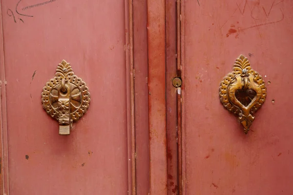Metal door knocker for man and woman in Iran. — Stock Photo, Image