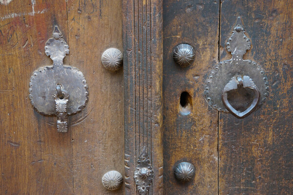 Door knocker for man and woman in Iran.