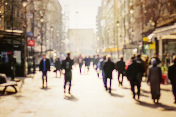 Blurred background. Blurred people walking through a city street — Stock Photo, Image