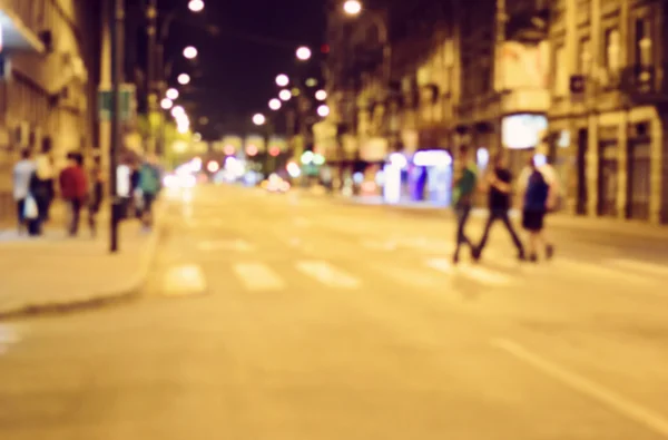 Fondo borroso. Luces de la ciudad nocturna borrosas. Foto retro tonificada, v —  Fotos de Stock