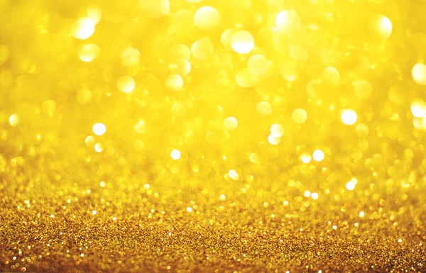 Yellow golden glittering Christmas lights. Blurred abstract back — Stock Photo, Image