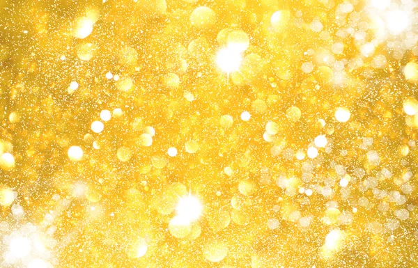 Amarelo dourado brilhando luzes de Natal. Abstrato borrado de volta — Fotografia de Stock