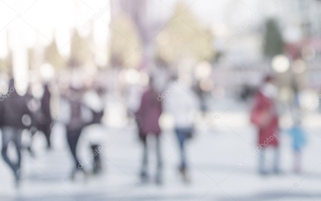 City commuters. High key blurred image of people walking in the 