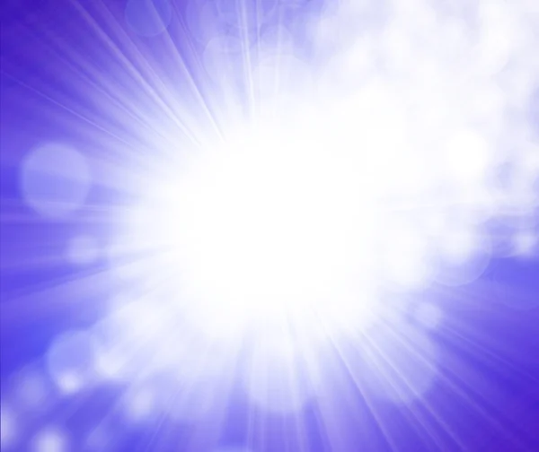 Sun on blue sky with lenses flare — Stock Photo, Image