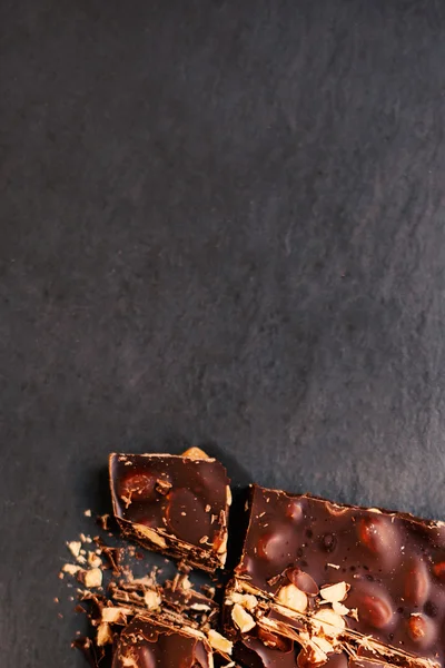 Chopped chocolate with nuts — Stock Photo, Image