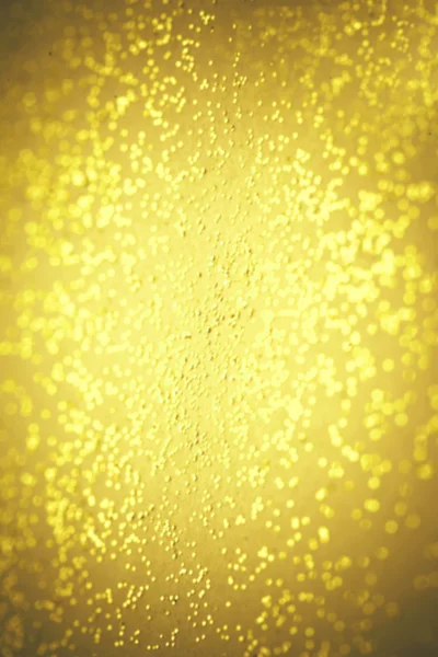 Abstracte gouden glitter textuur. Defocused feestelijke kerst en — Stockfoto