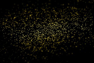 Soyut altın glitter doku siyah bir arka plan. Defocused