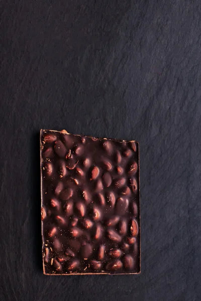 Beautiful Chocolate bar over black  background with copy space f — Stock Photo, Image