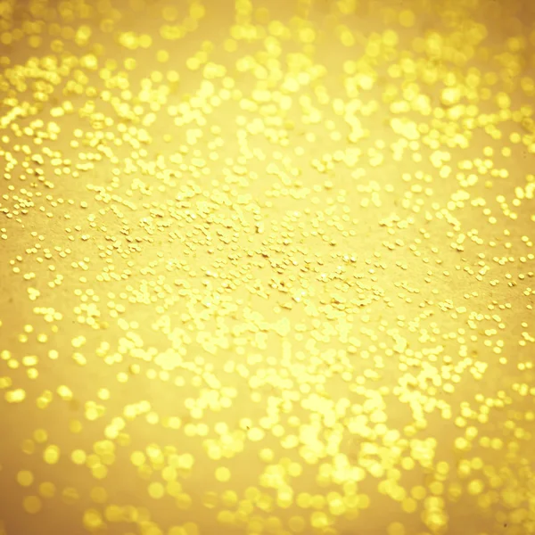 ぼやけたゴールド輝きテクスチャです。抽象的なボケ味黄金キラキラ背景 — ストック写真