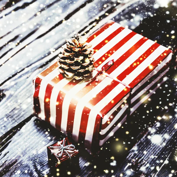 Christmas gift box on wooden board — Stock Photo, Image