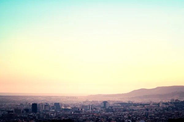 Bird view over city in sunset. — Stock Photo, Image