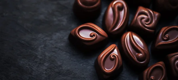 Deliciosos doces de chocolate fundo . — Fotografia de Stock
