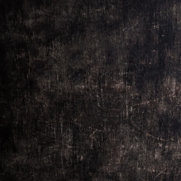 Placa de madeira grunge riscado escuro . — Fotografia de Stock