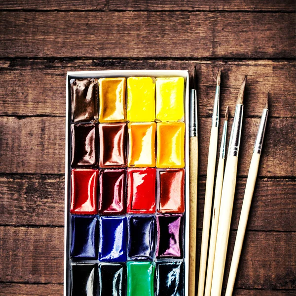 Paints and brushes — Stock Photo, Image