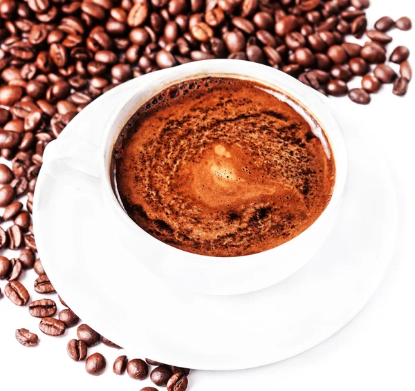 Coffee cup and saucer with coffee beans — Stock Photo, Image