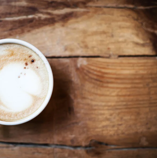 Cup of Coffee on rustic wooden table — Stock Photo, Image