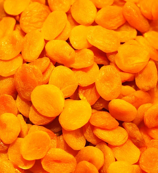 Halda sušené meruňky pozadí — Stock fotografie