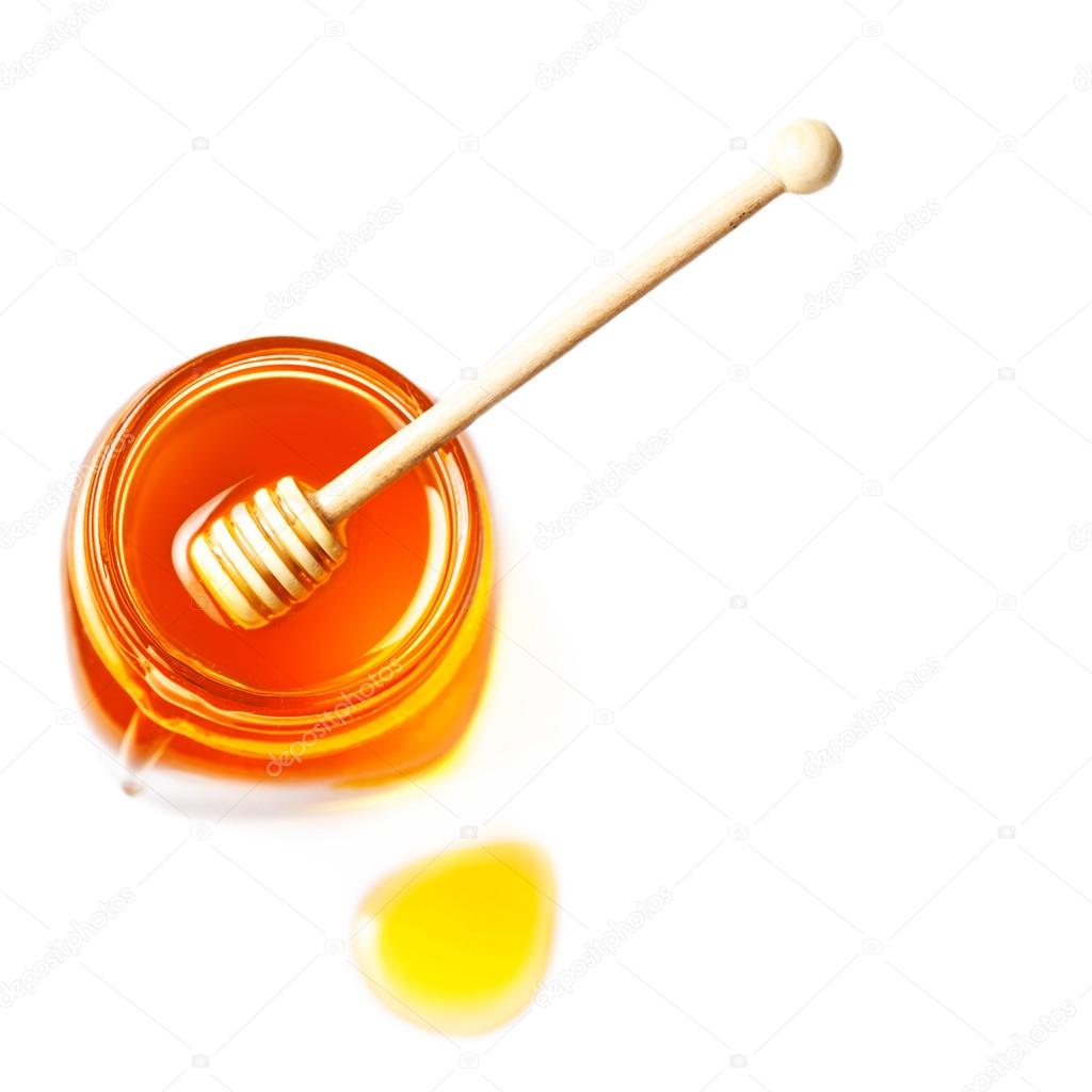 Fresh honey with a honey dipper
