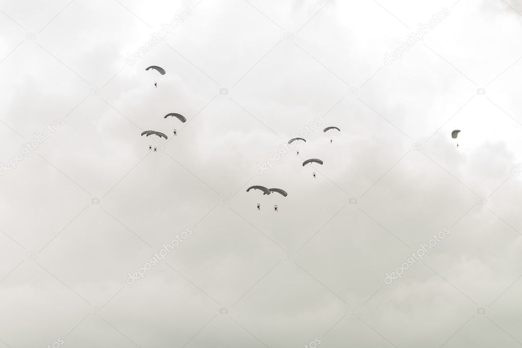 Parachutists in sky