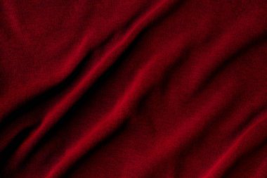 Jersey pamuk kumaşı. Kırışmış koyu kırmızı tekstil arkaplanı