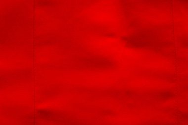 Kırmızı saten kumaş. Gelinlik tekstil arka planı