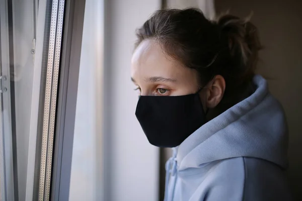 Girl Black Mask Blue Shirt Standing Window House Isolation Girl — Stock Photo, Image