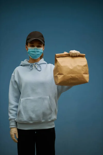 Girl Courier Medical Mask Medical Gloves Blue Background Delivery Service — Stock Photo, Image