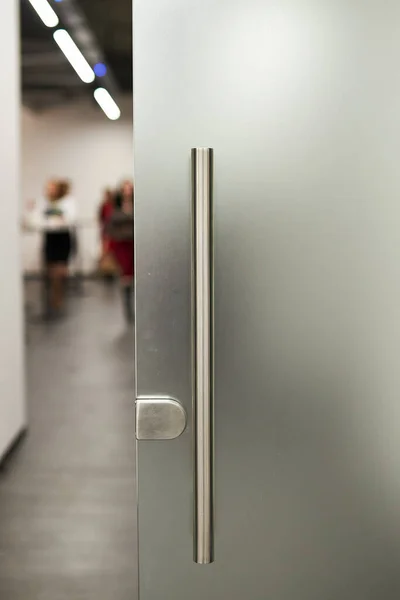 Glass frosted door with a metal handle. glass door. Frosted glass background