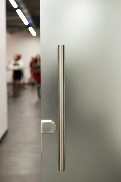 Glass frosted door with a metal handle. glass door. Frosted glass background