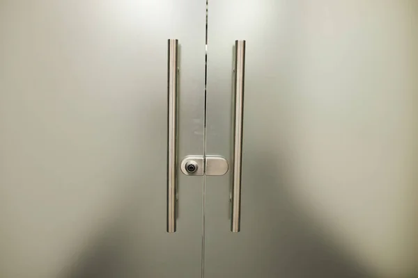 Glass frosted door with a metal handle. glass door. Frosted glass background